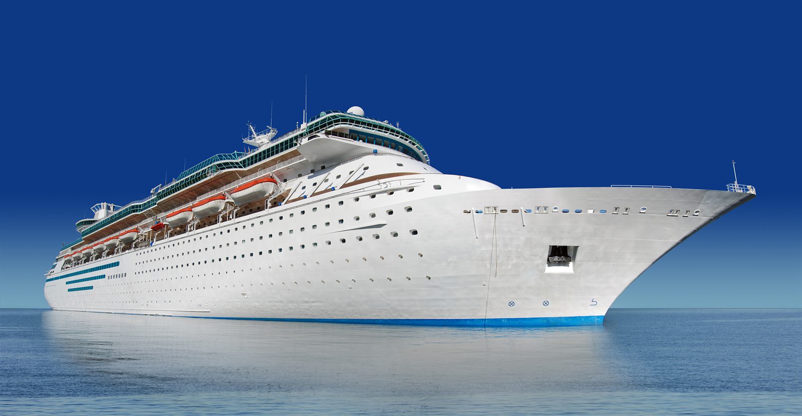 White cruise ship at sea seen from the side