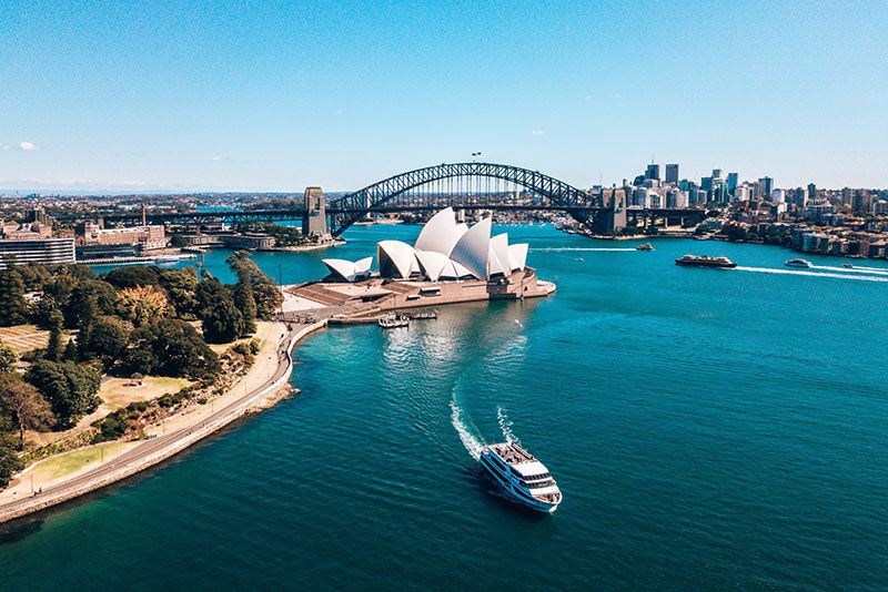 Boat crossing Sydney Harbour near the Opera House